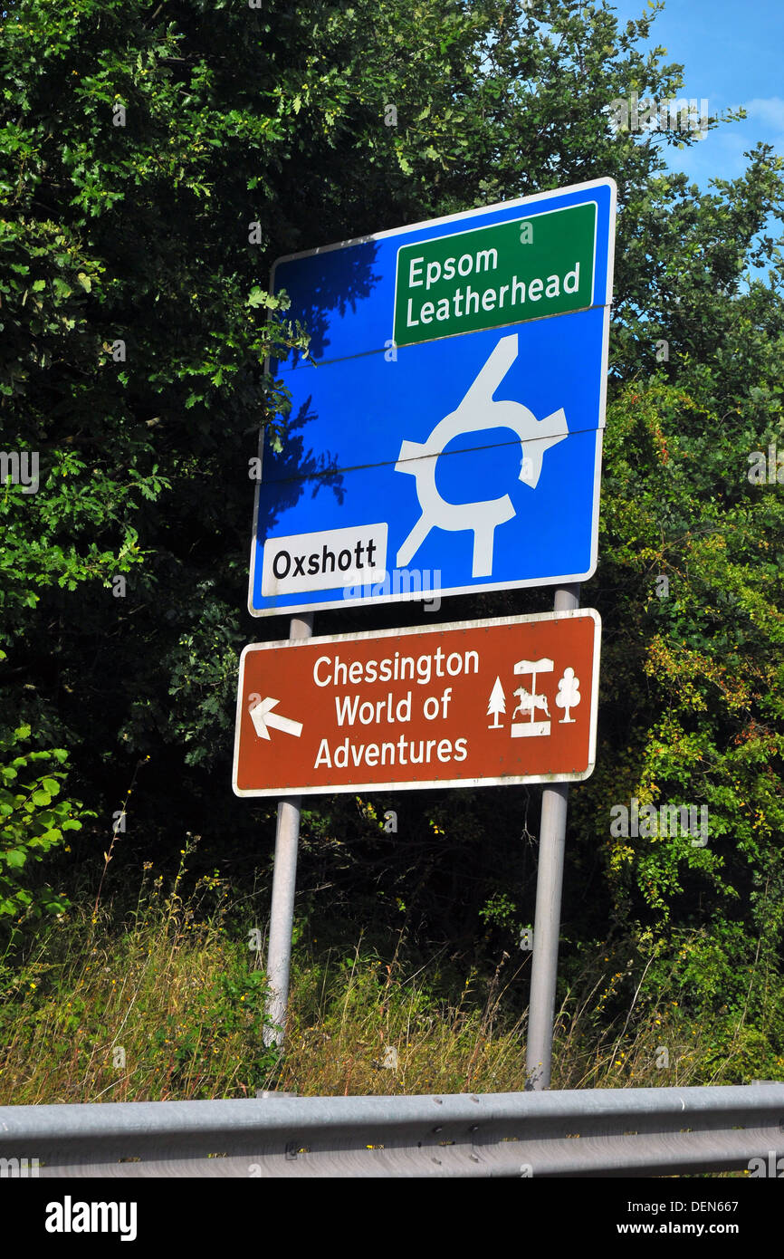 A British roundabout road sign directing traffic to Epsom and Leatherhead. Stock Photo