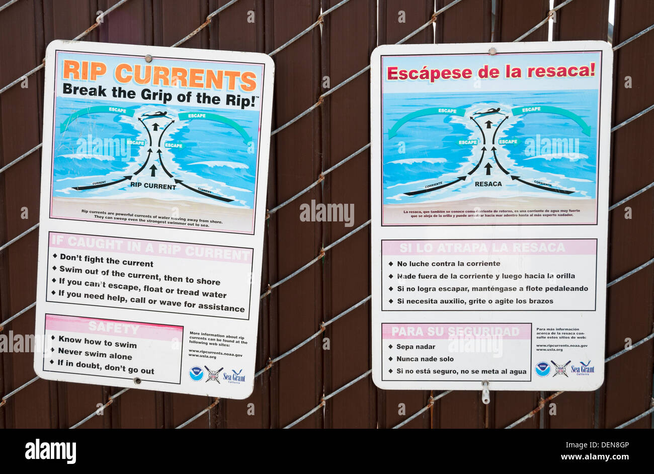 California, La Jolla, bilingual rip currents warning signs in english and spanish Stock Photo