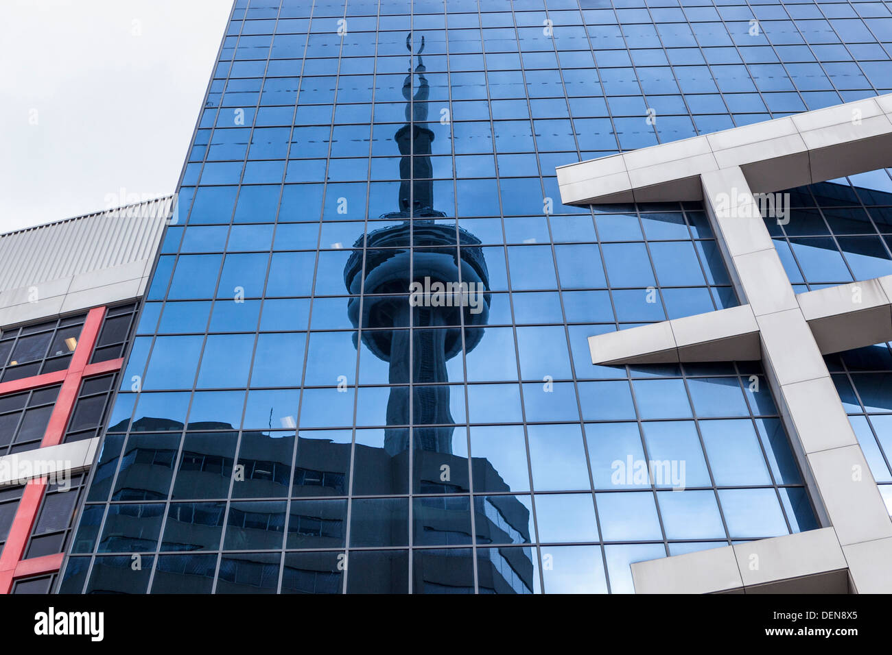 Reflection of the CN tower, the tallest structure in Toronto, in the glass windows of a tall building Stock Photo