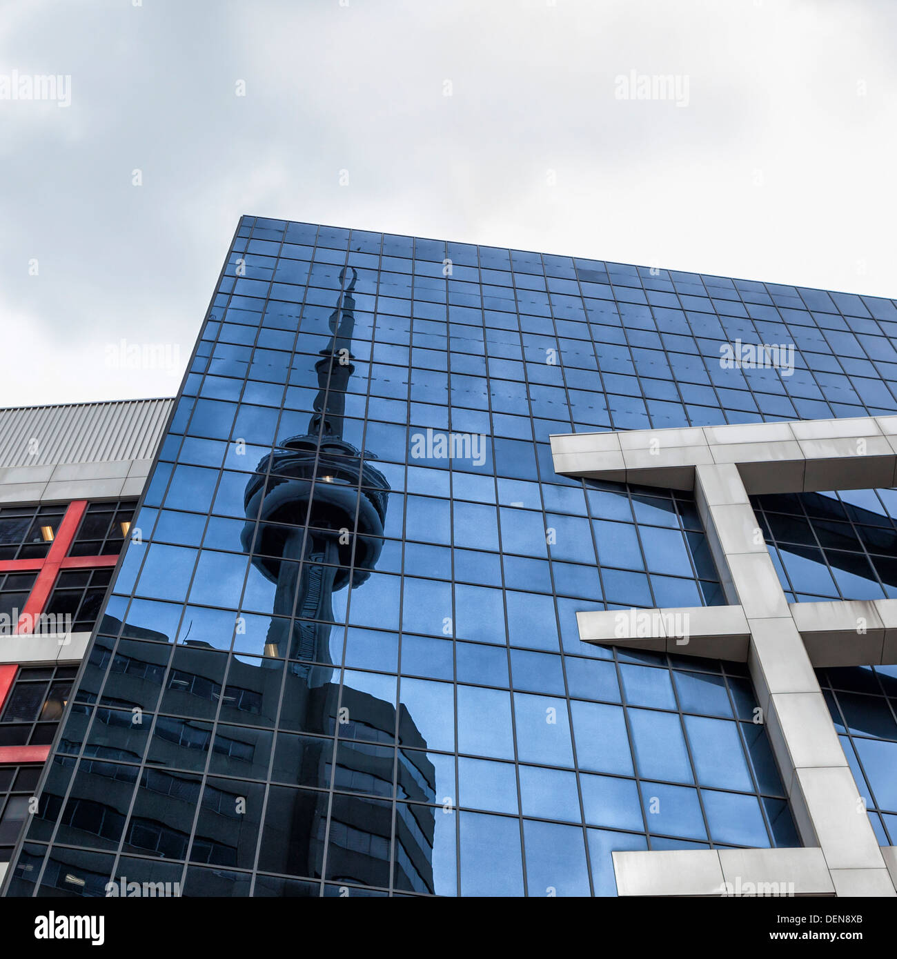 Reflection of the CN tower, the tallest structure in Toronto, in the glass windows of a tall building Stock Photo