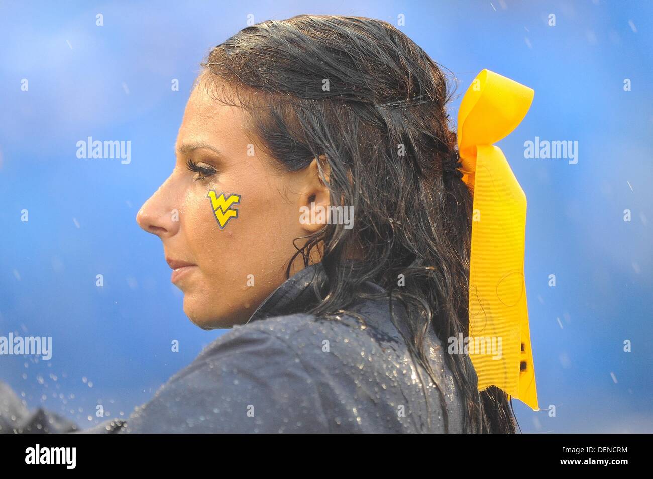 Baltimore, MD, USA. 21st Sep, 2013. A Mountaineer cheerleader watches her team as she gets soaked from the heavy rain during a match up between the Maryland Terrapins and the West Virginia Mountaineers at M&T Bank Stadium in Baltimore, MD. The Terrapins shut out the Mountaineers 37-0. Credit:  Cal Sport Media/Alamy Live News Stock Photo