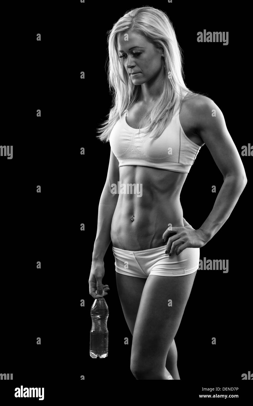 tired woman after training with bottle of water Stock Photo