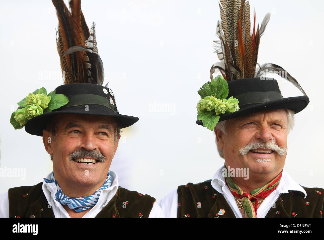 Munich, Germany. 21st Sep, 2013. Two men wear traditional German hats at  the Oktoberfest in Munich, Germany, 21 September 2013. The Oktoberfest is  held from 21 September until 06 October 2013. Photo: