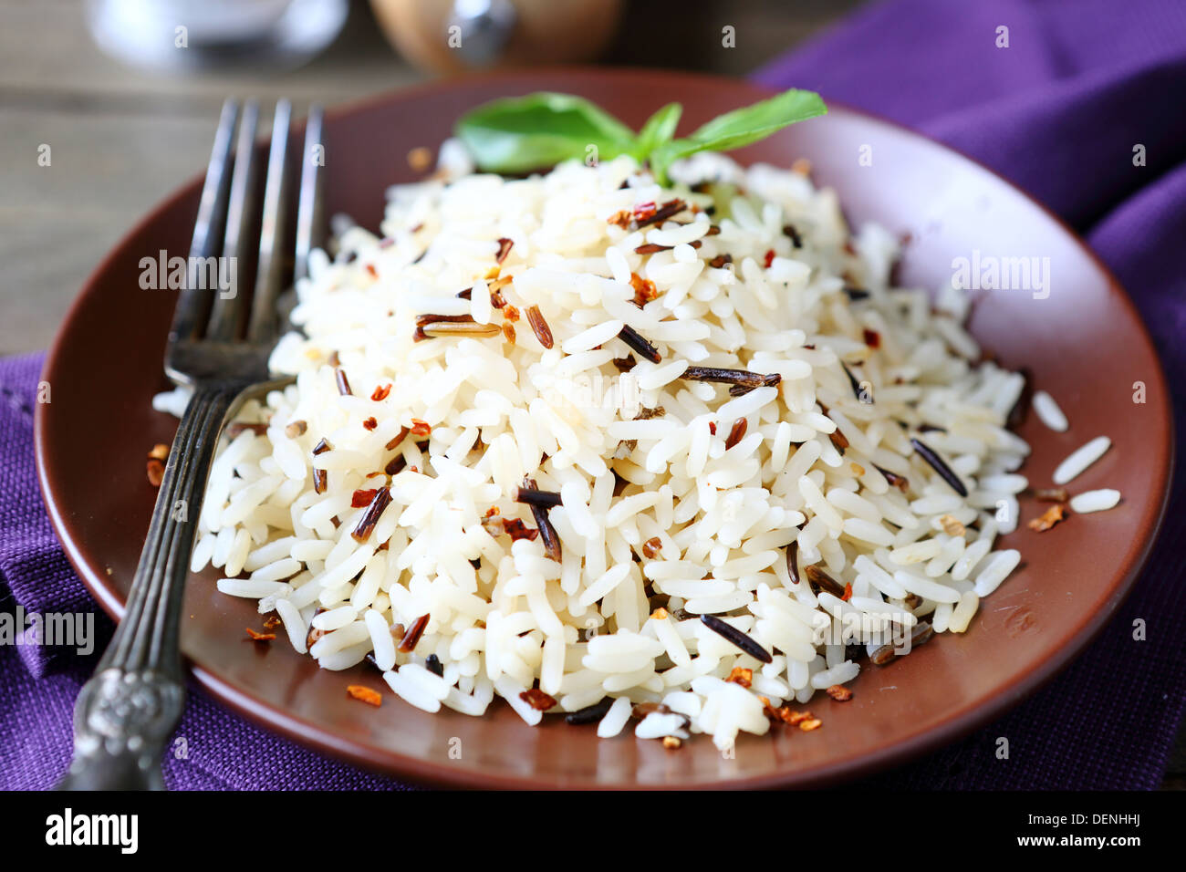 plate full of cooked rice, white and wild, food close up Stock Photo