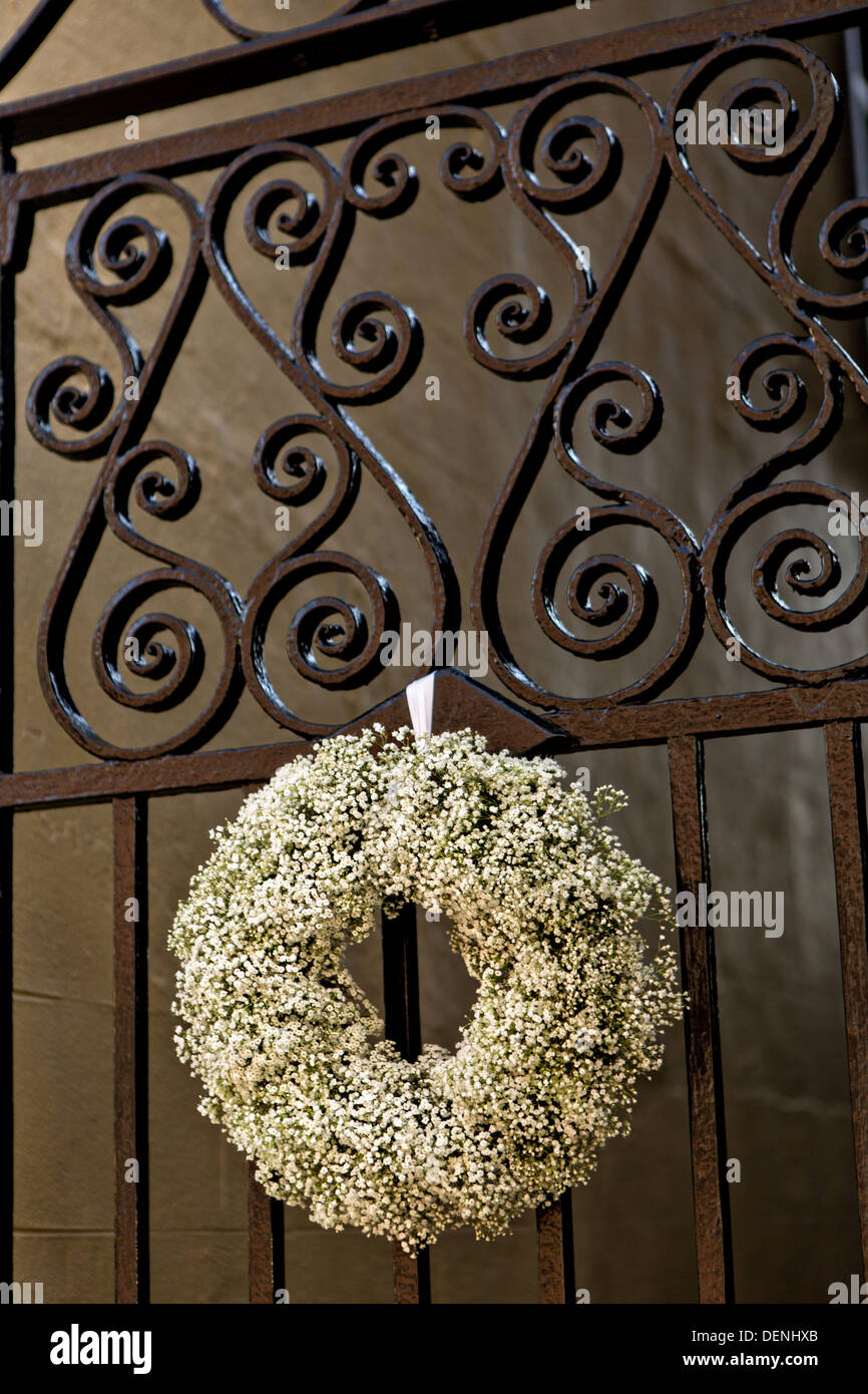 Decorative iron gates with popcorn berry wreath at a historic home in Charleston, SC. Stock Photo