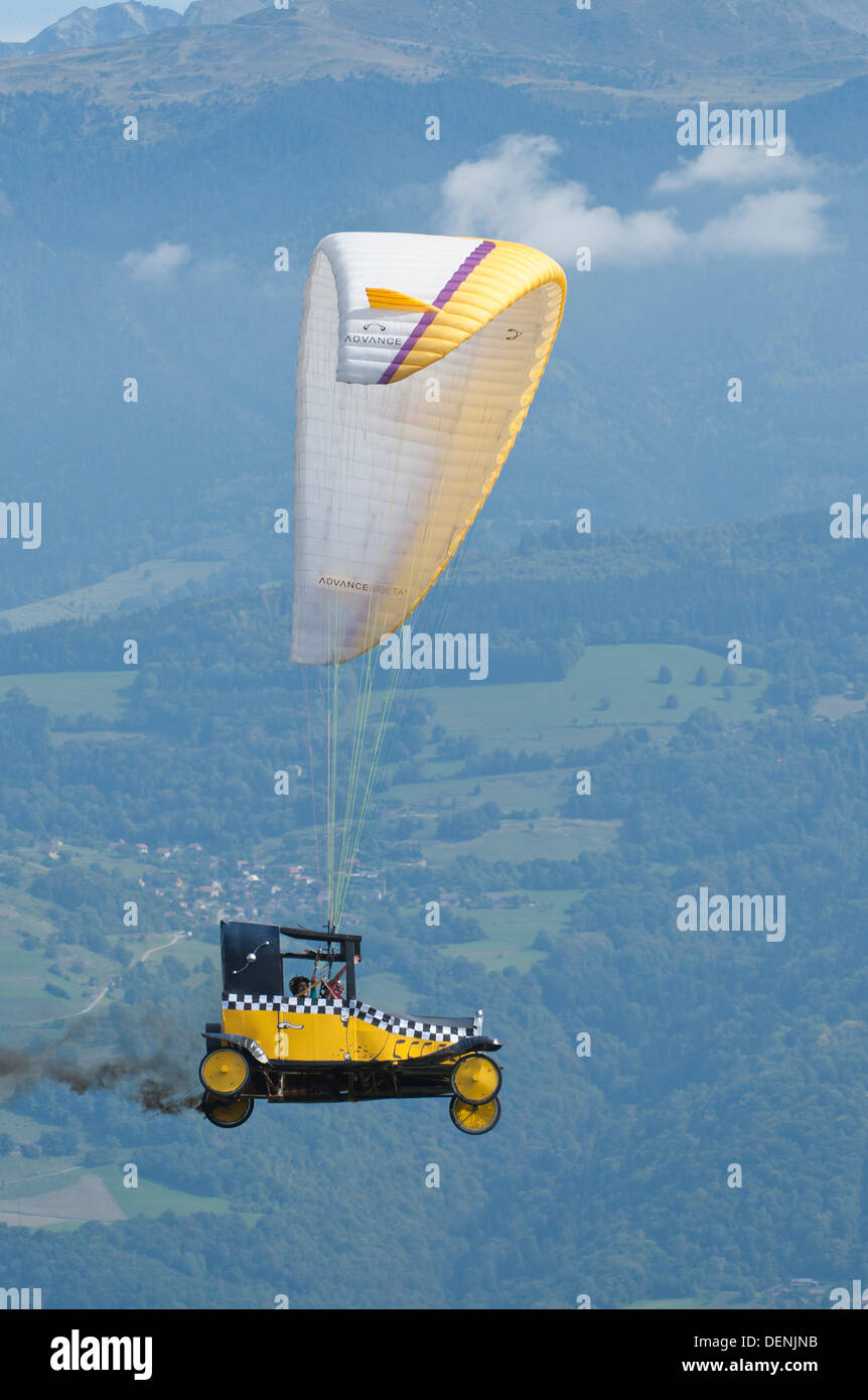 St Hilaire Du Touvet, France. 22nd Sep, 2013. On a perfect late summer day thousands of spectators flock to the spectacle of paraglider pilots taking off from an alpine cliff face dressed up in elaborate fancy dress. Photo credit: Graham M. Lawrence/Alamy Live News. Stock Photo