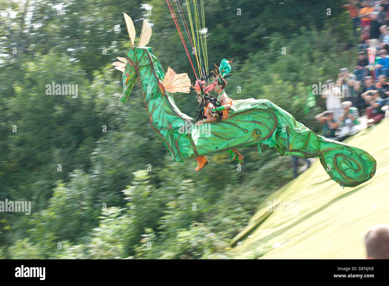 St Hilaire Du Touvet, France. 22nd Sep, 2013. On a perfect late summer day thousands of spectators flock to the spectacle of paraglider pilots taking off from an alpine cliff face dressed up in elaborate fancy dress. Photo credit: Graham M. Lawrence/Alamy Live News. Stock Photo