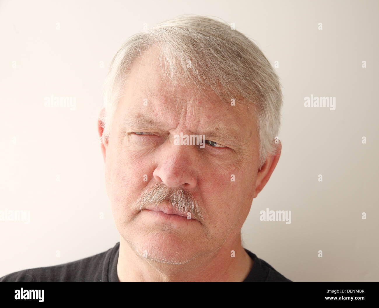 senior with a suspicious expression Stock Photo