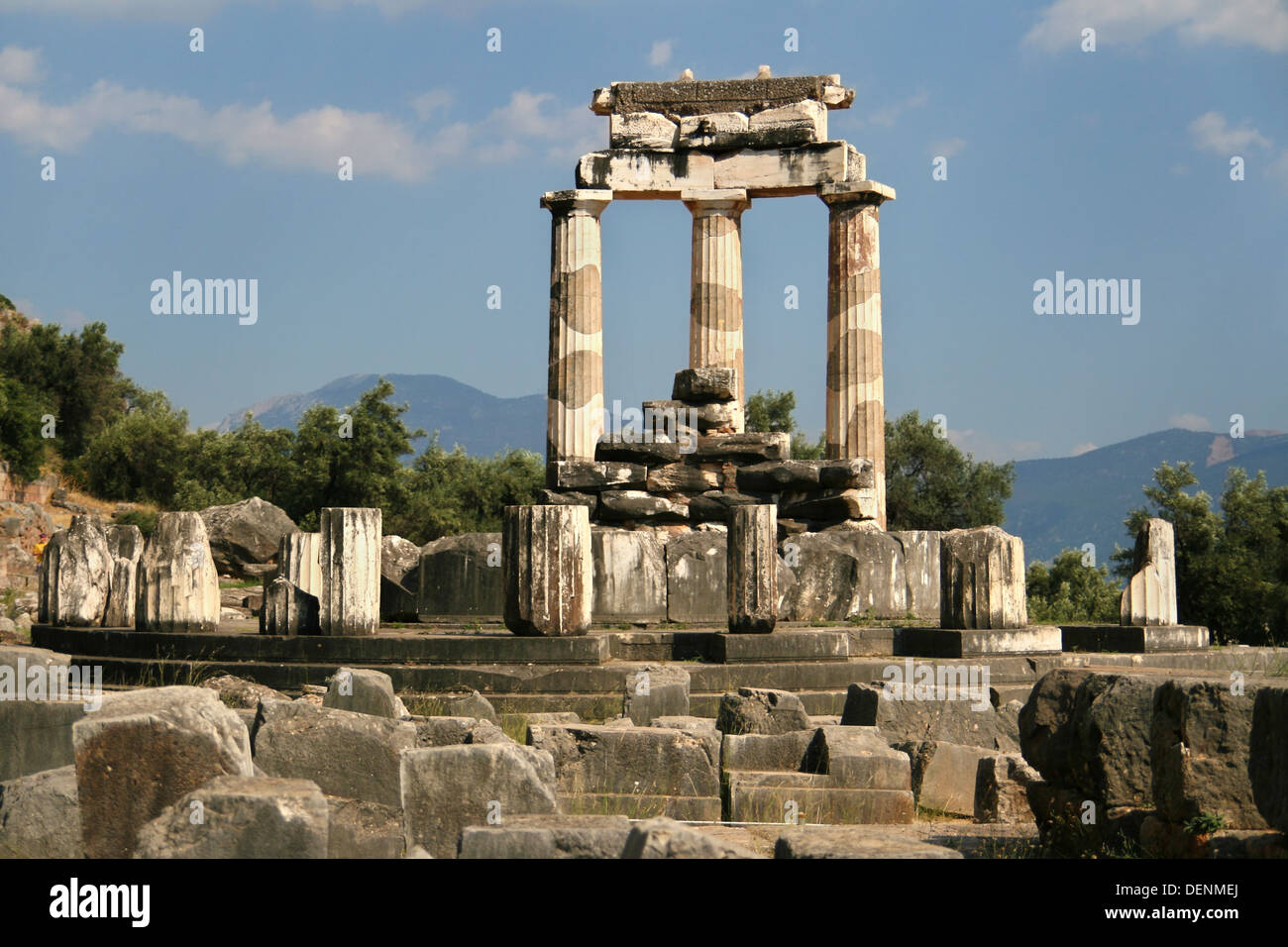 Three columns still standing in the sanctuary of Athena Pronaia in Delphi, Greece. Stock Photo