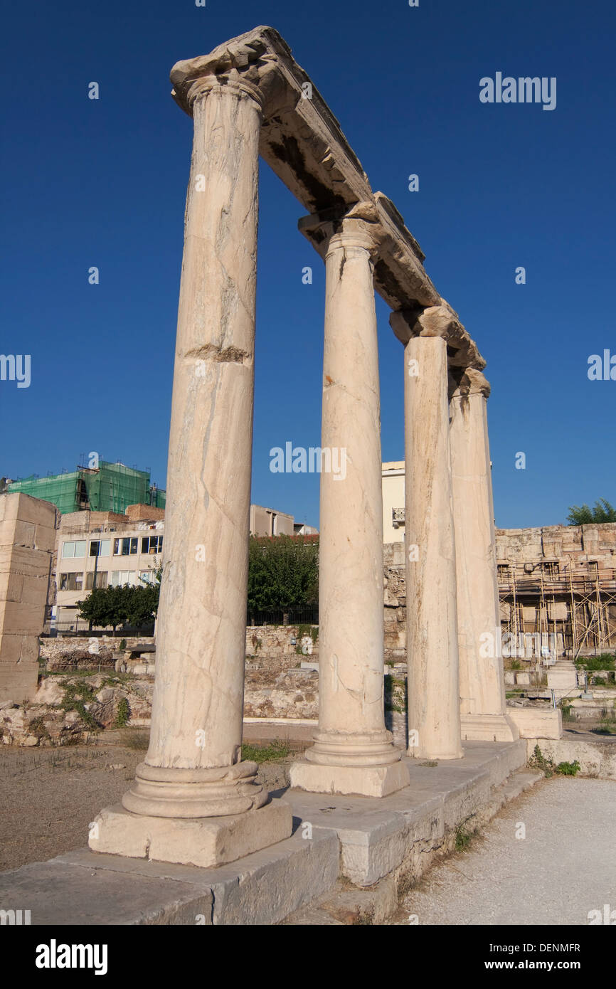 Row of four ionic columns made of gray Hymettian marble in the Roman Agora of Athens, Greece. Stock Photo