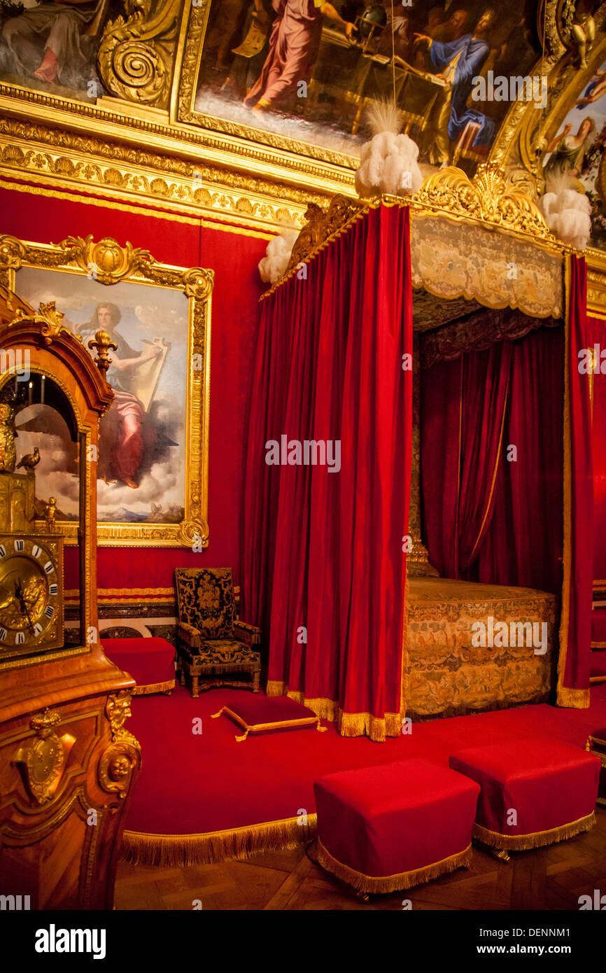 Red bed chamber at Chateau de Versailles near Paris France Stock Photo