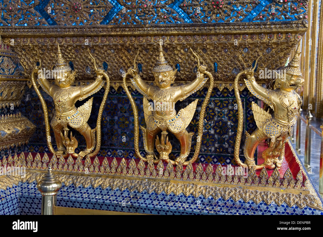 Garudas and Nagas decorating the Ubosoth. Stock Photo