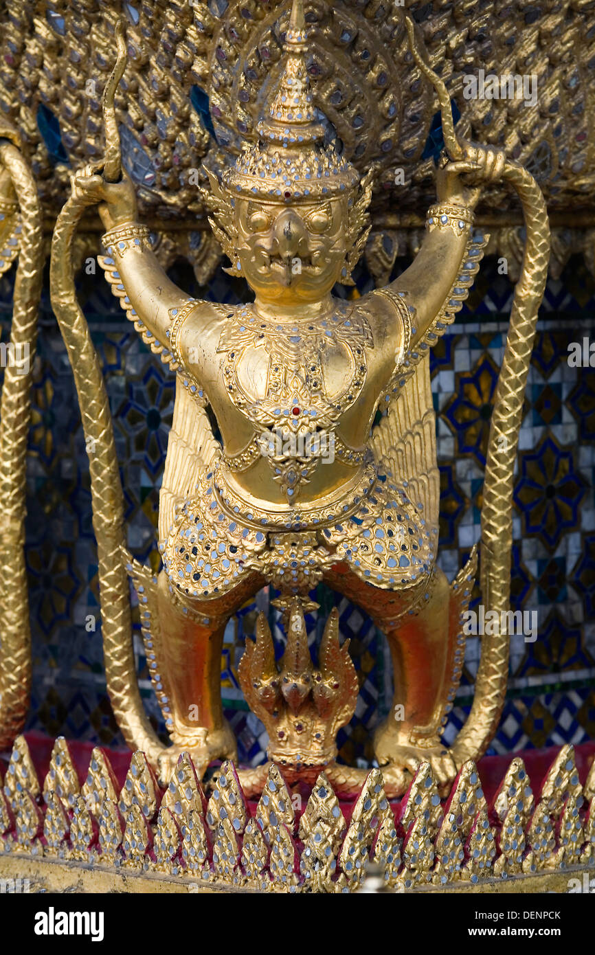 Garudas and Nagas decorating the Ubosoth. Stock Photo