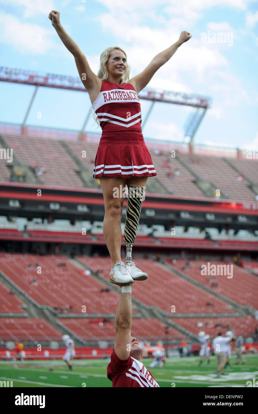 Piscataway, New Jersey, USA. 21st Sep, 2013. September 21, 2013: An amputee cheerleader from the Arkansas Razorbacks is held up with one hand during the game between Arkansas Razorbacks and Rutgers Scarlet Knights at Highpoint Solutions Stadium in Piscataway, NJ. Rutgers Scarlet Knights defeated The Arkansas Razorbacks 28-24. © csm/Alamy Live News Stock Photo