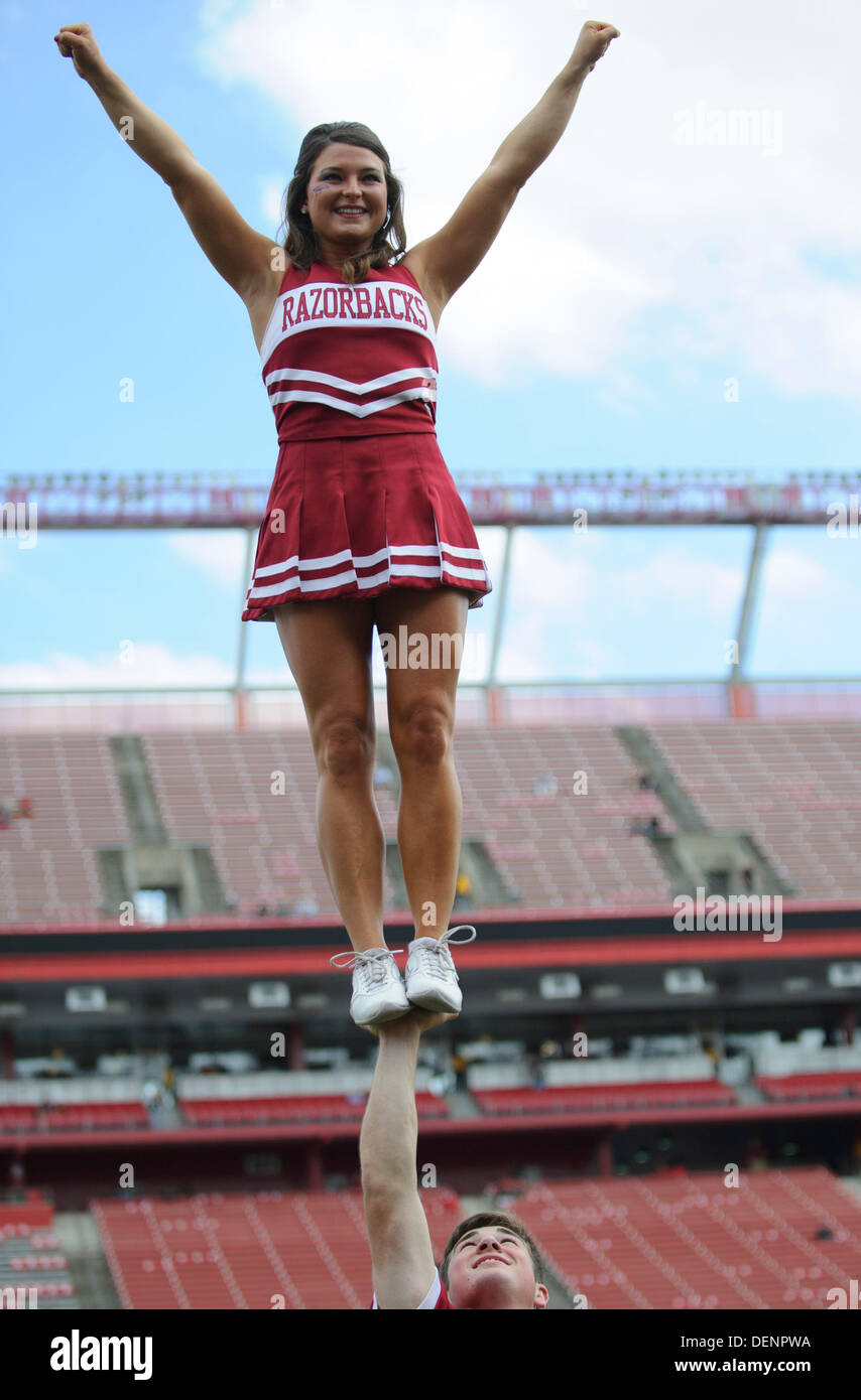 Piscataway, New Jersey, USA. 21st Sep, 2013. September 21, 2013: An Arkansas Razorbacks cheerleader is held in the air with one hand during the game between Arkansas Razorbacks and Rutgers Scarlet Knights at Highpoint Solutions Stadium in Piscataway, NJ. Rutgers Scarlet Knights defeated The Arkansas Razorbacks 28-24. © csm/Alamy Live News Stock Photo