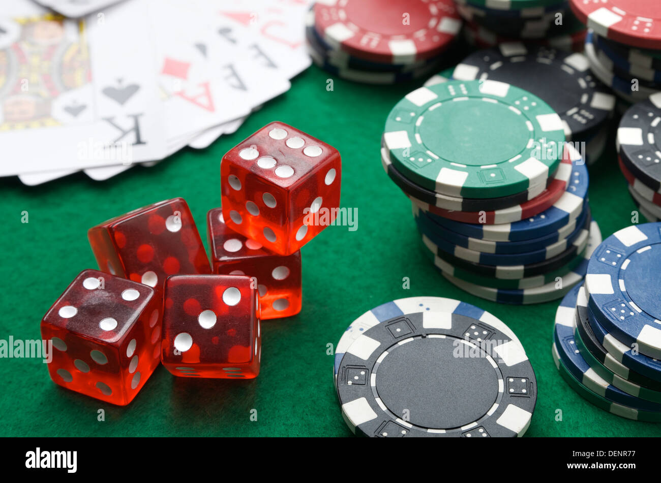 dices, cards and casino chips on a green baize Stock Photo