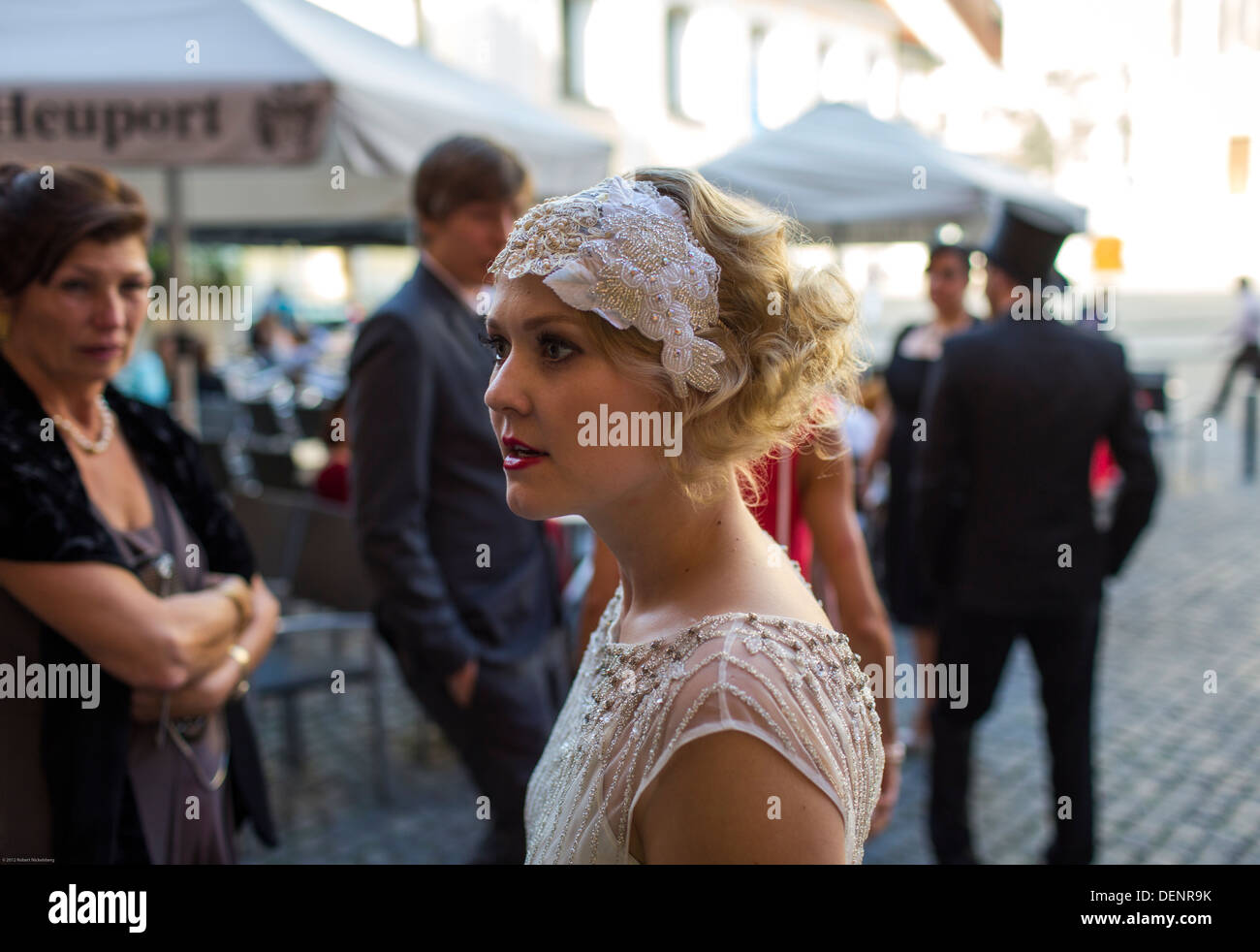 A Bride And Her Wedding Party Walk Near The Front Of St