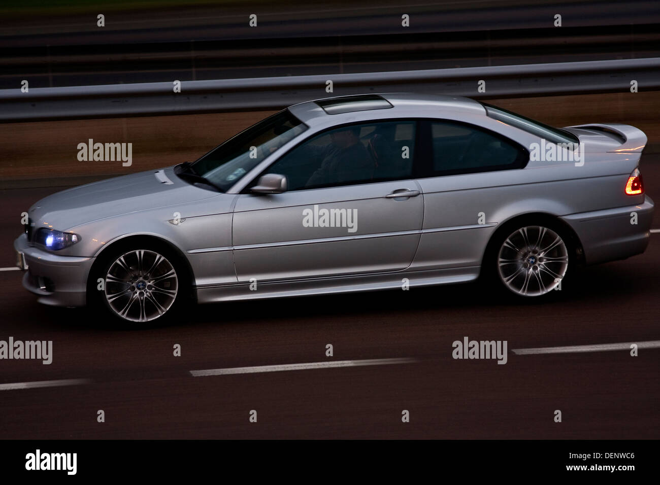 Rear sync flash technique used to capture a BMW car travelling along