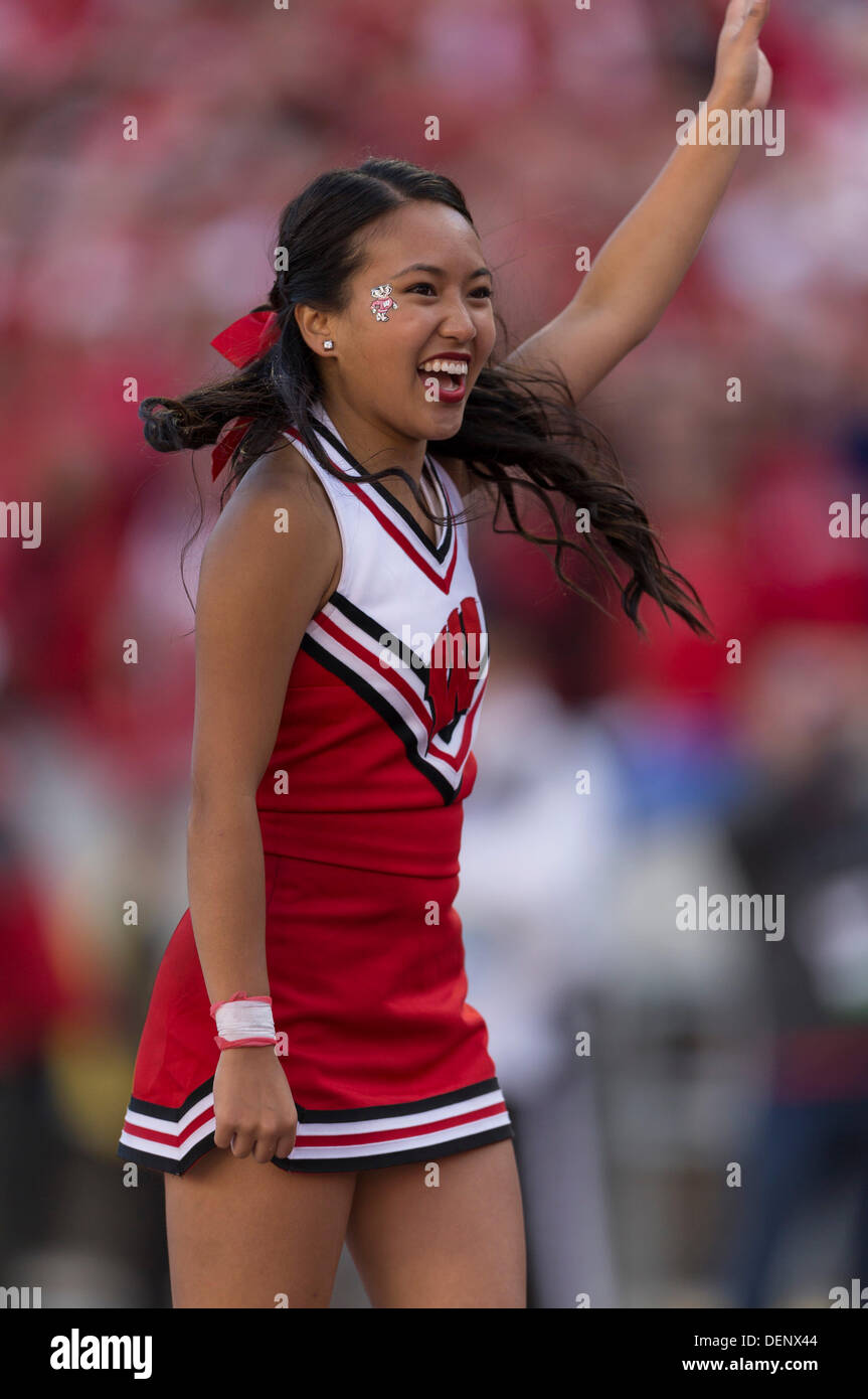 Madison, Wisconsin, USA. 21st Sep, 2013. September 21, 2013: A Wisconsin Badgers Cheerleader entertains the crowd during the NCAA Football game between the Purdue Boilermakers and the Wisconsin Badgers at Camp Randall Stadium in Madison, WI. Wisconsin defeated Purdue 41-10 in the Big Ten opener for both teams. John Fisher/CSM/Alamy Live News Stock Photo