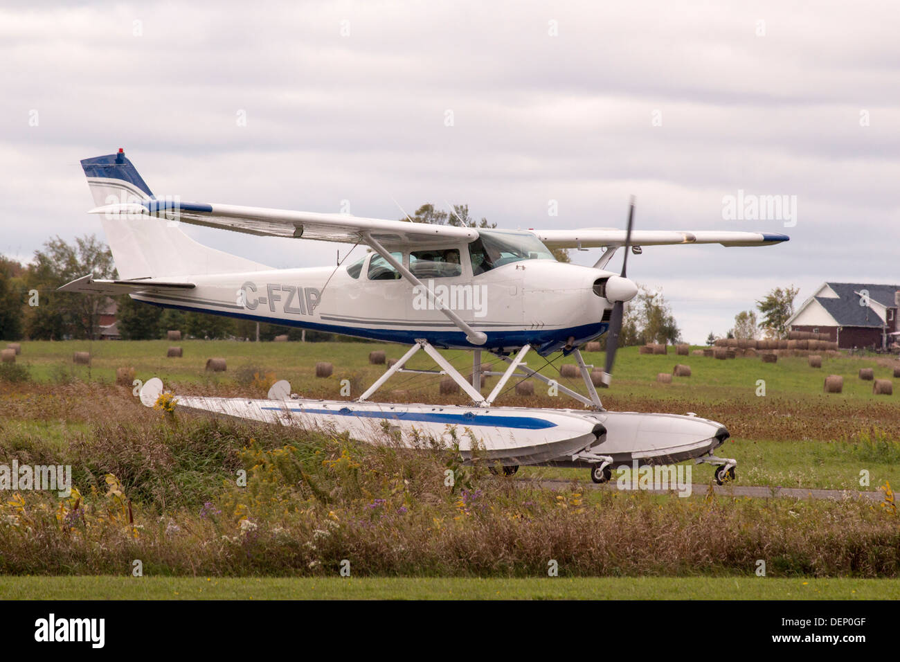 Small float plane on runway at Kawartha Lakes Airport in Lindsay Ontario Stock Photo