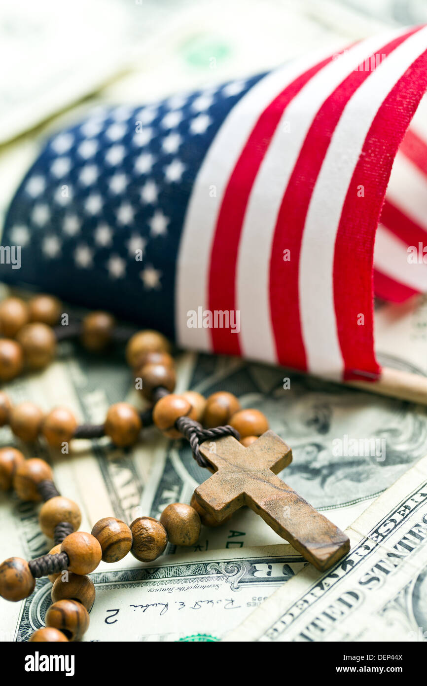 rosary beads with american flag on us dollars background Stock Photo