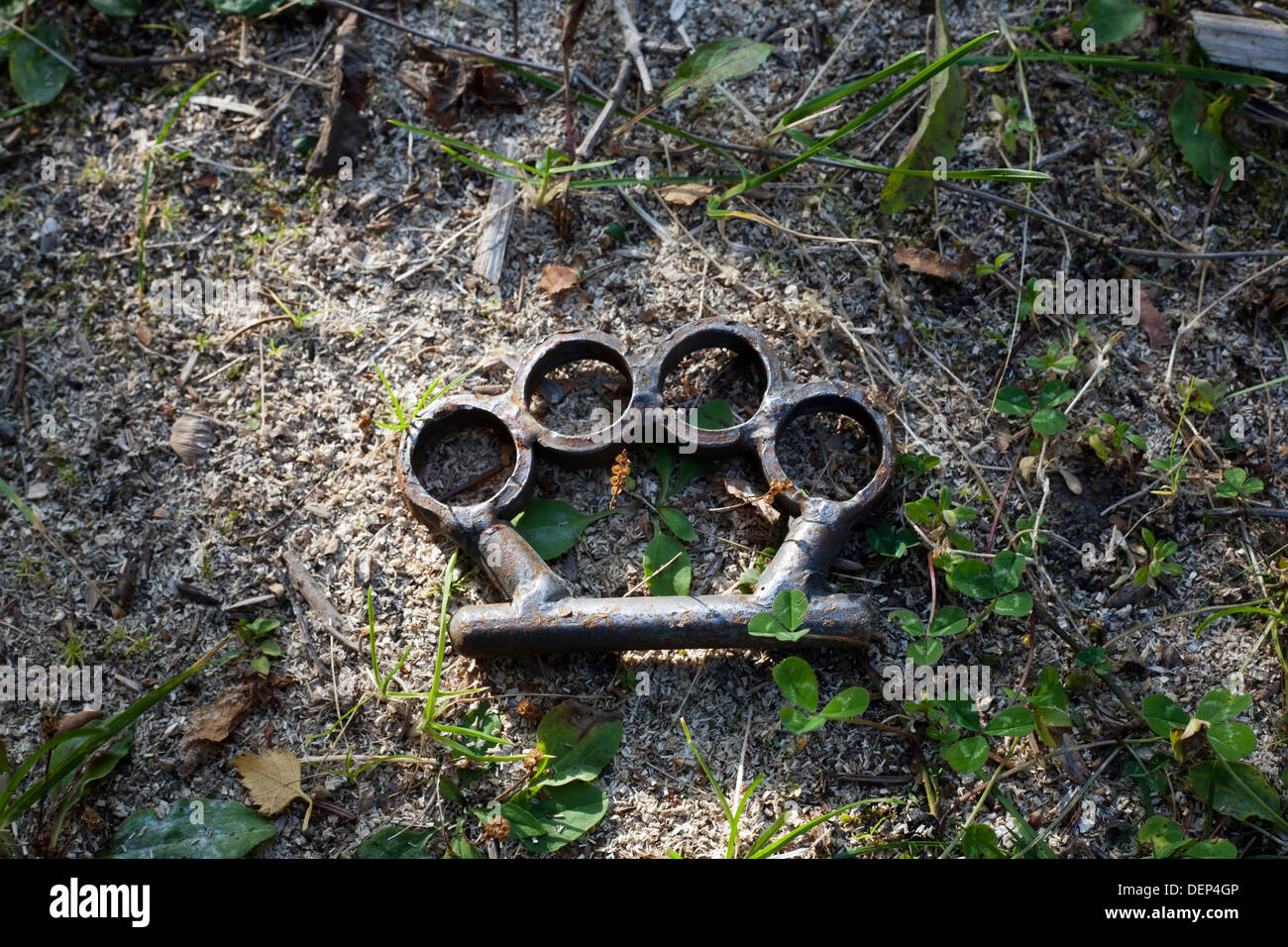 brass knuckles on ground Stock Photo Alamy