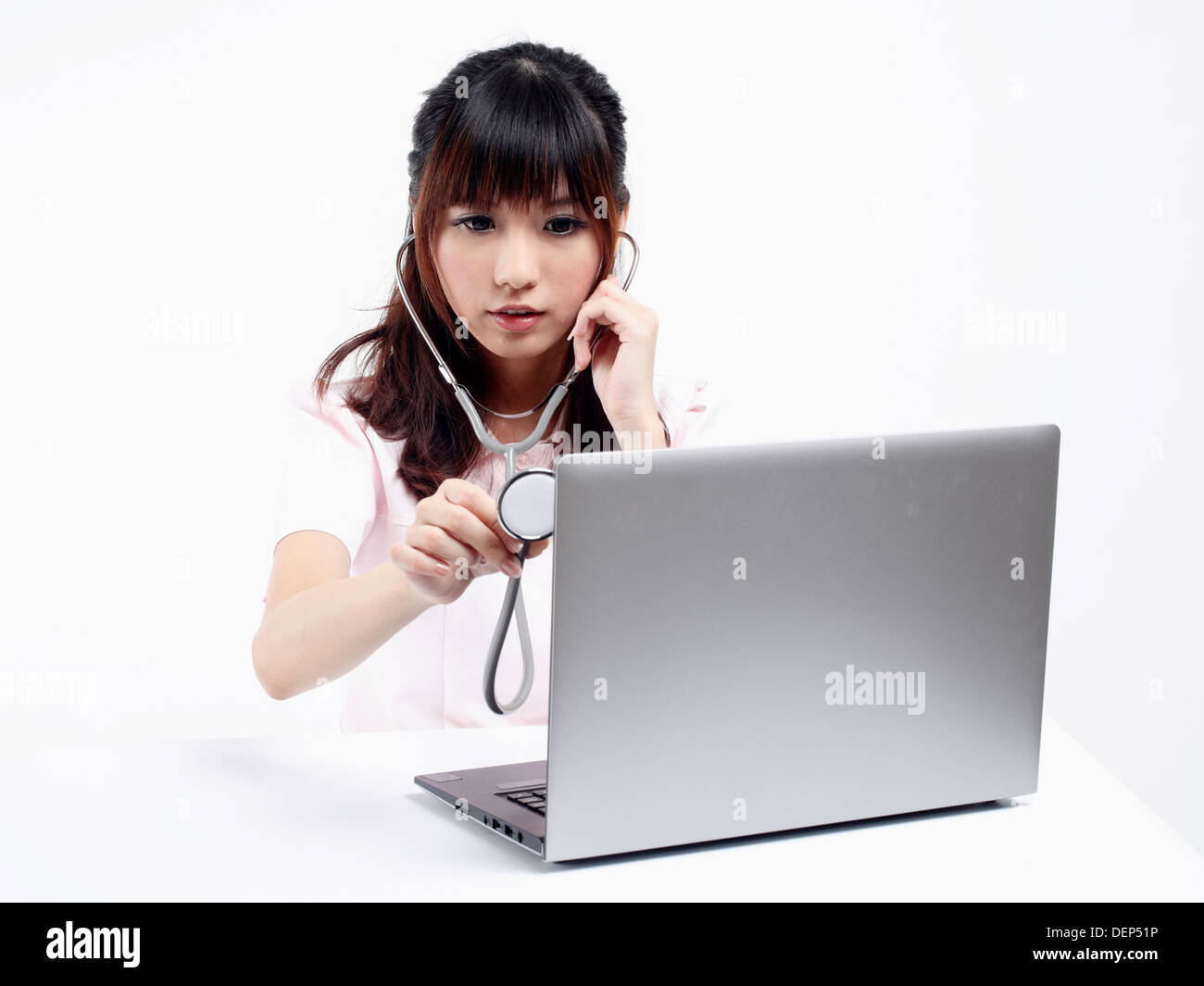 Nurse works with computer Stock Photo - Alamy