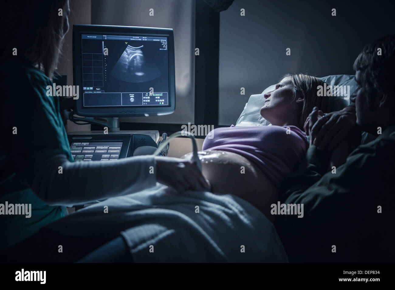 Pregnant couple having sonogram Stock Photo