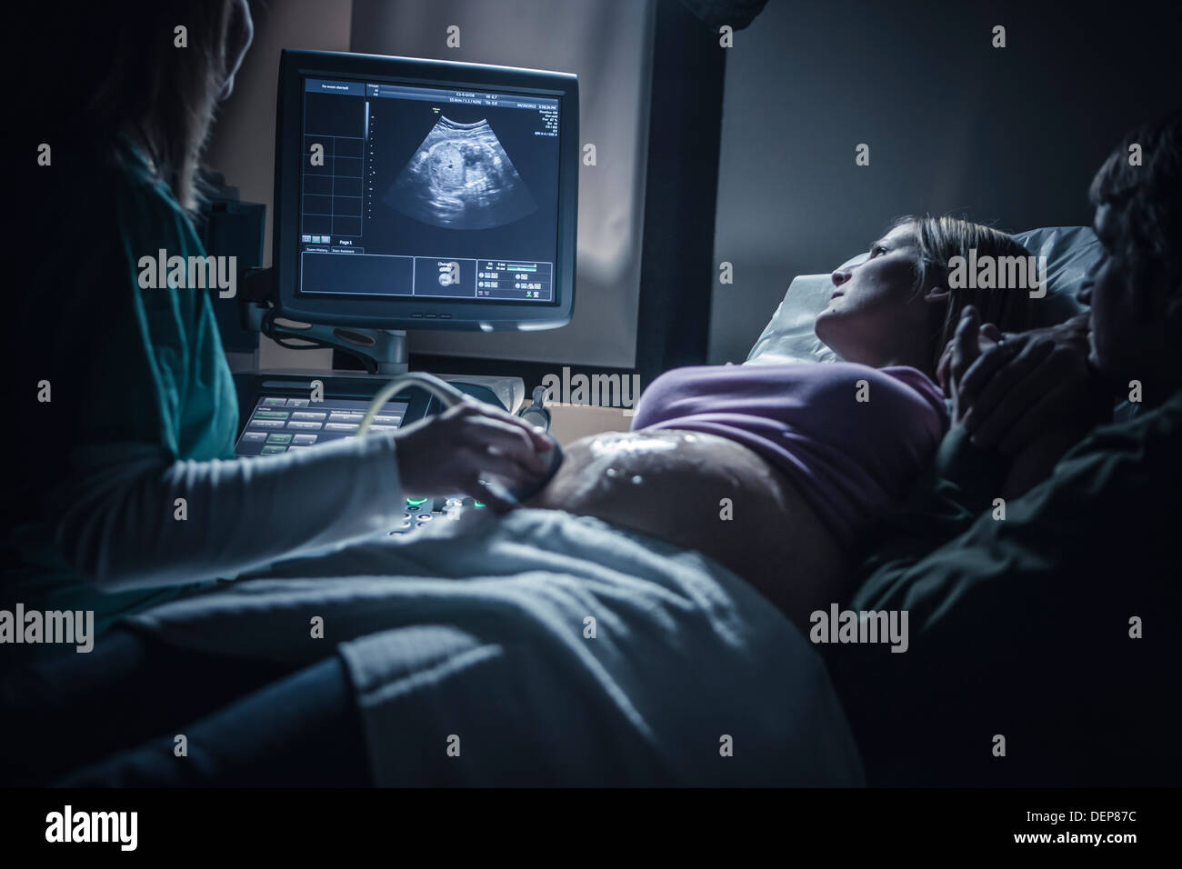 Pregnant couple having sonogram Stock Photo
