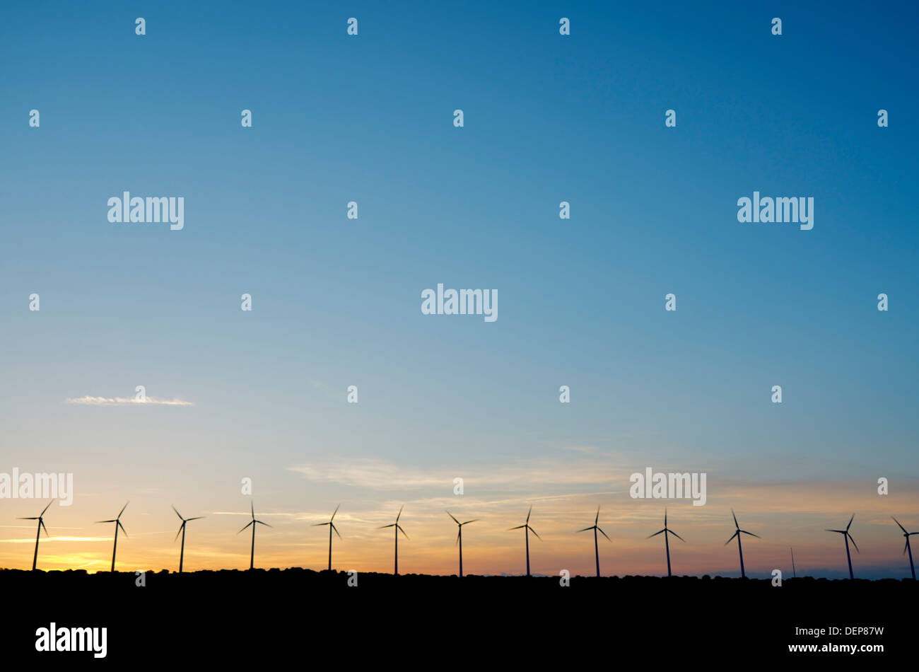 wind mills lined up for production of electric energy, El Buste, Saragosa, Aragon, Spain Stock Photo