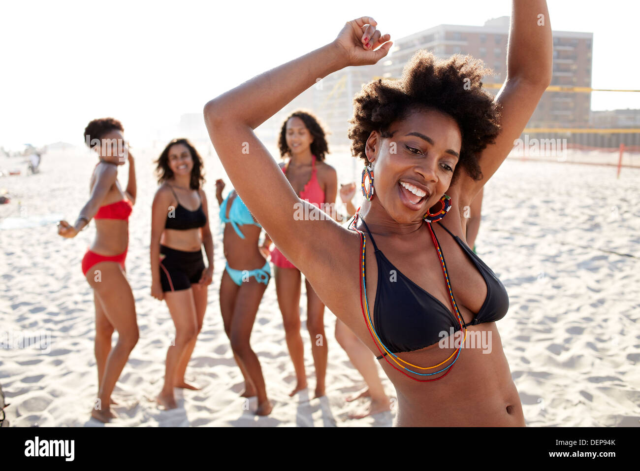 Woman dancing on beach Stock Photo