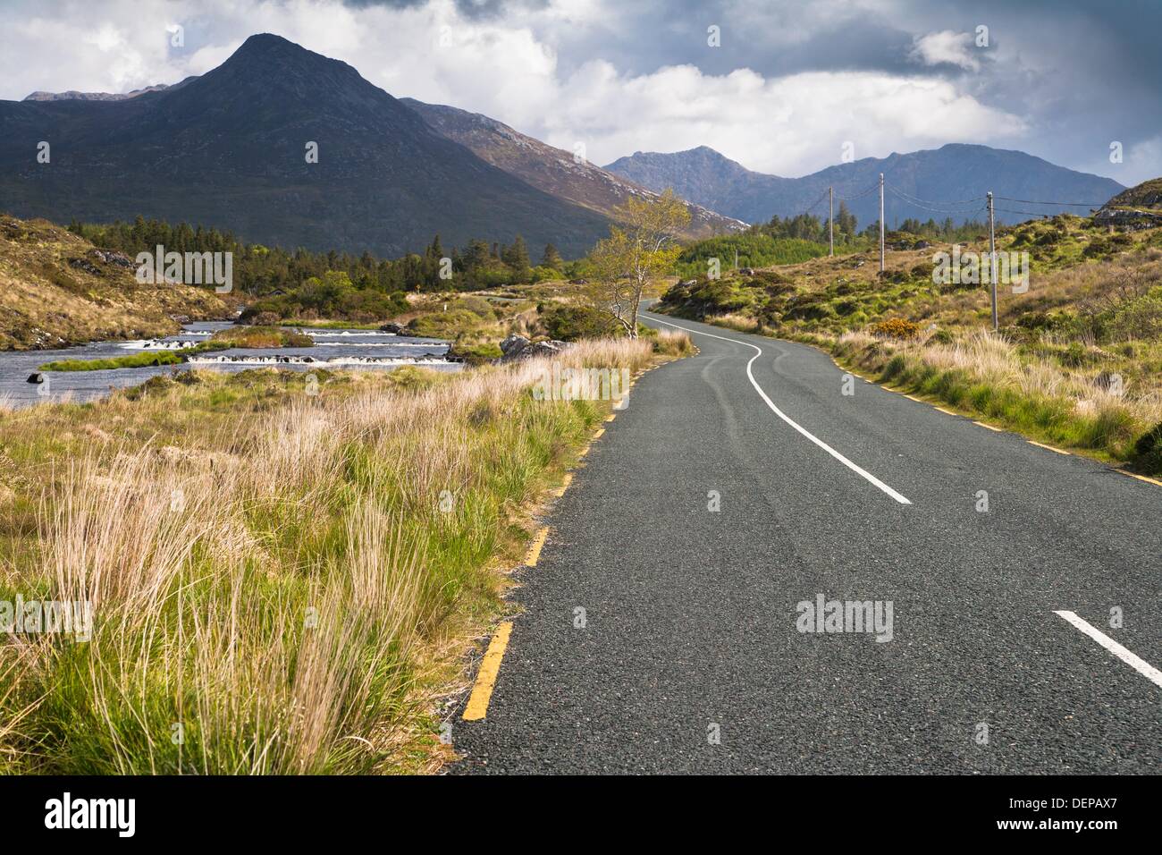Road along the Owenmore River, Connemara, County Galway, Ireland, Europe Stock Photo