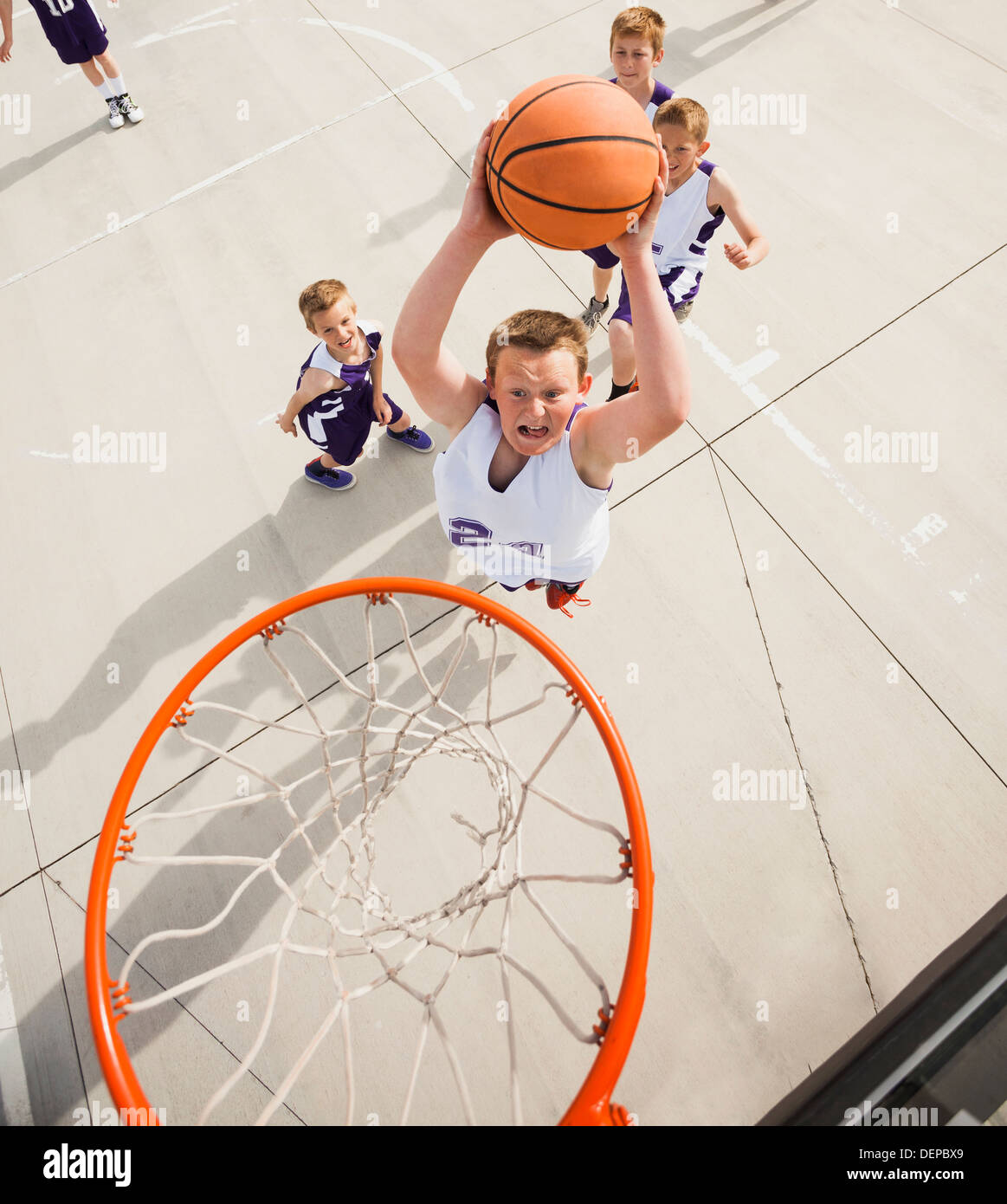 High angle view of a boy playing basketball hi-res stock