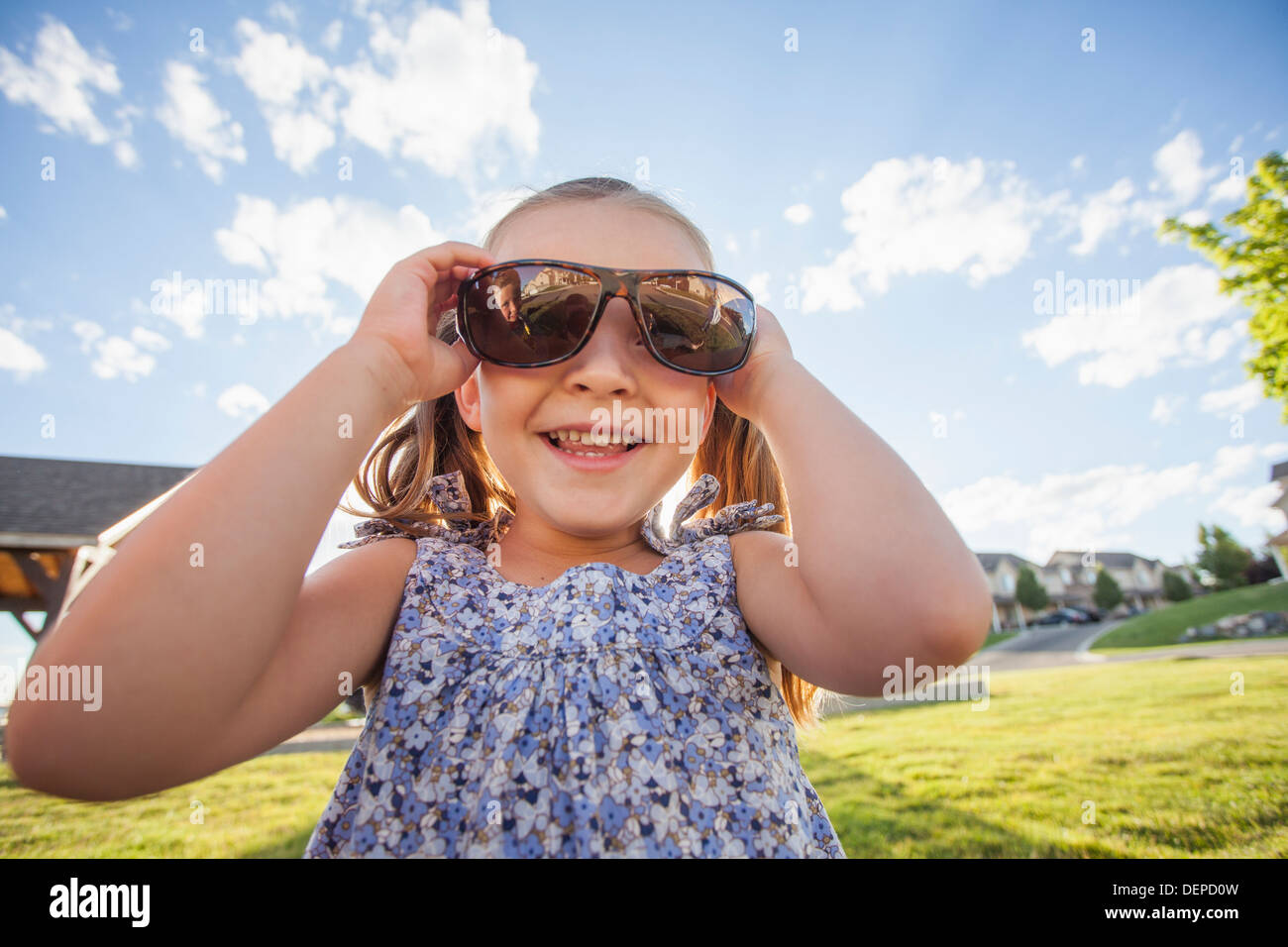 Caucasian girl wearing sunglasses outdoors Stock Photo