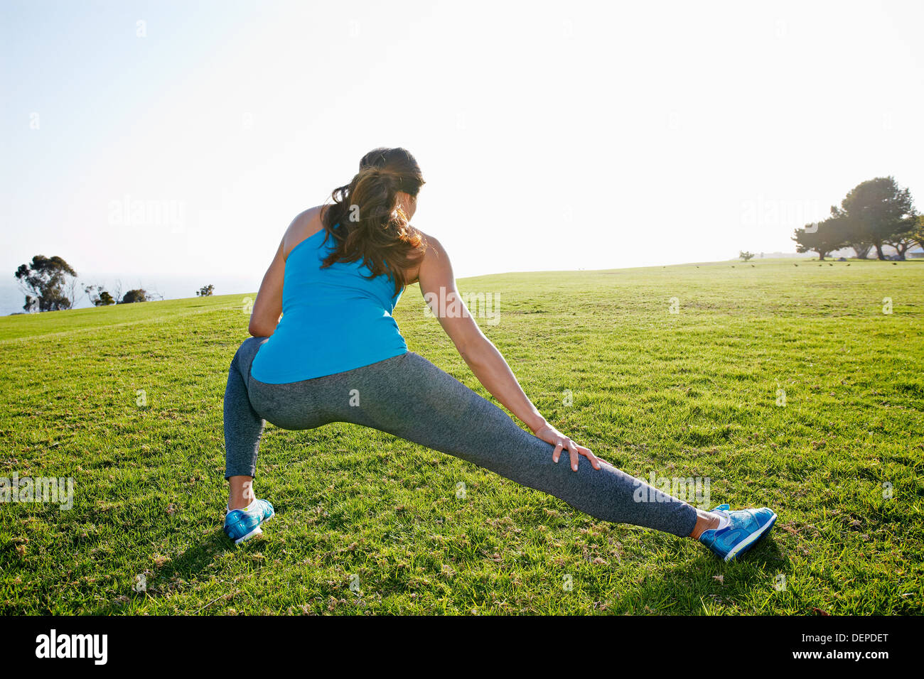 Person stretching grass hi-res stock photography and images - Alamy