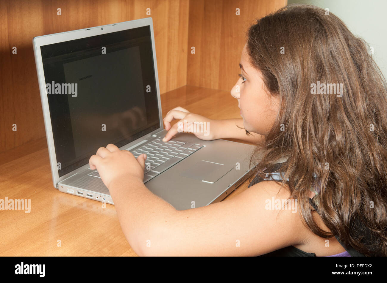 Girl using laptop Stock Photo