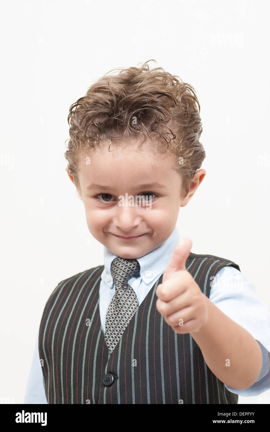 Boy in waistcoat and tie thumbs up Stock Photo
