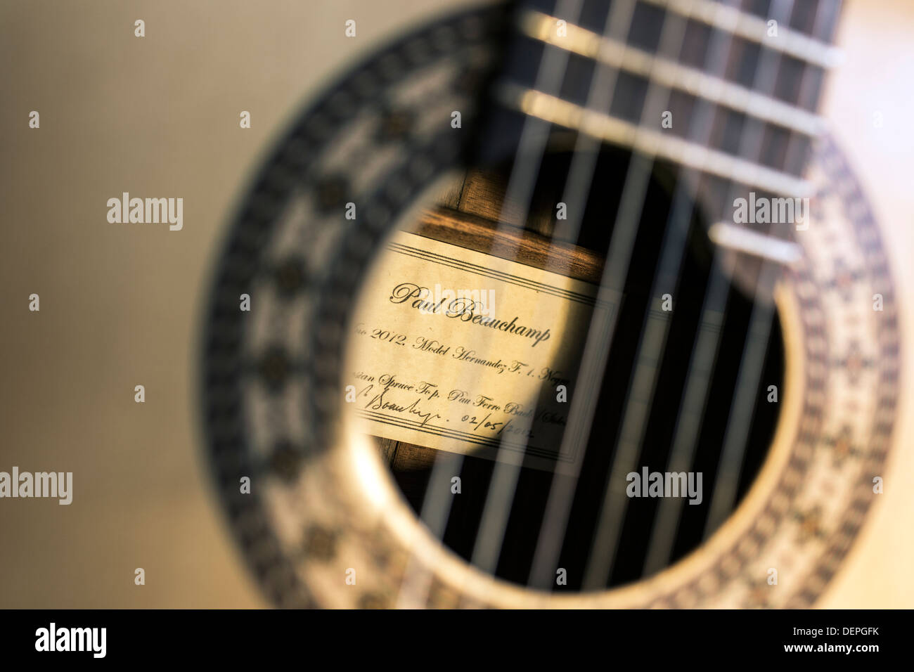 Close up of manufacture label on acoustic guitar Stock Photo