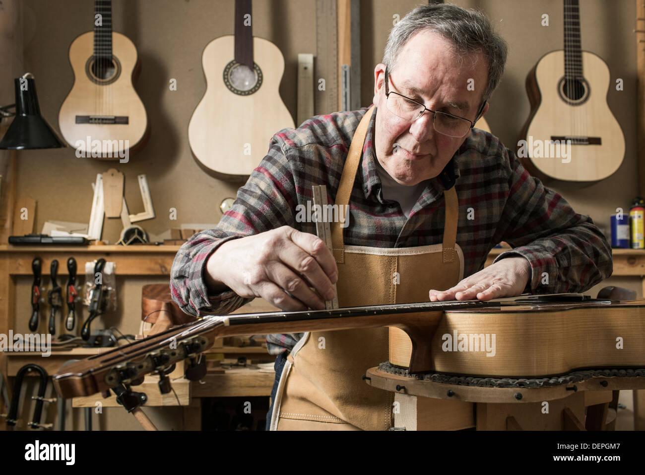 Stringed Instrument Maker Stock Photos & Stringed Instrument Maker