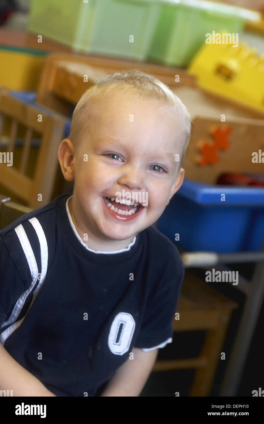 3 year old boy laughing at nursery, headshot Stock Photo Alamy