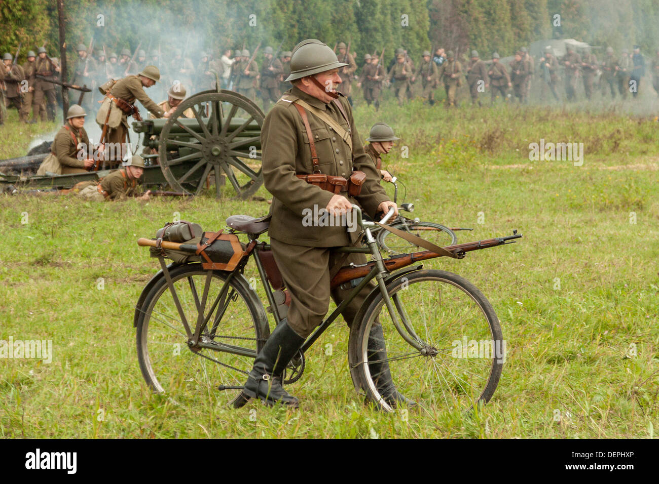 Lomianki, Poland. 22nd Sep, 2013. 22nd September, 2013. Polish soldier riding a bicycle during Battle at Lomianki - historical reenactment, Poland Credit:  Travelfile/Alamy Live News Stock Photo