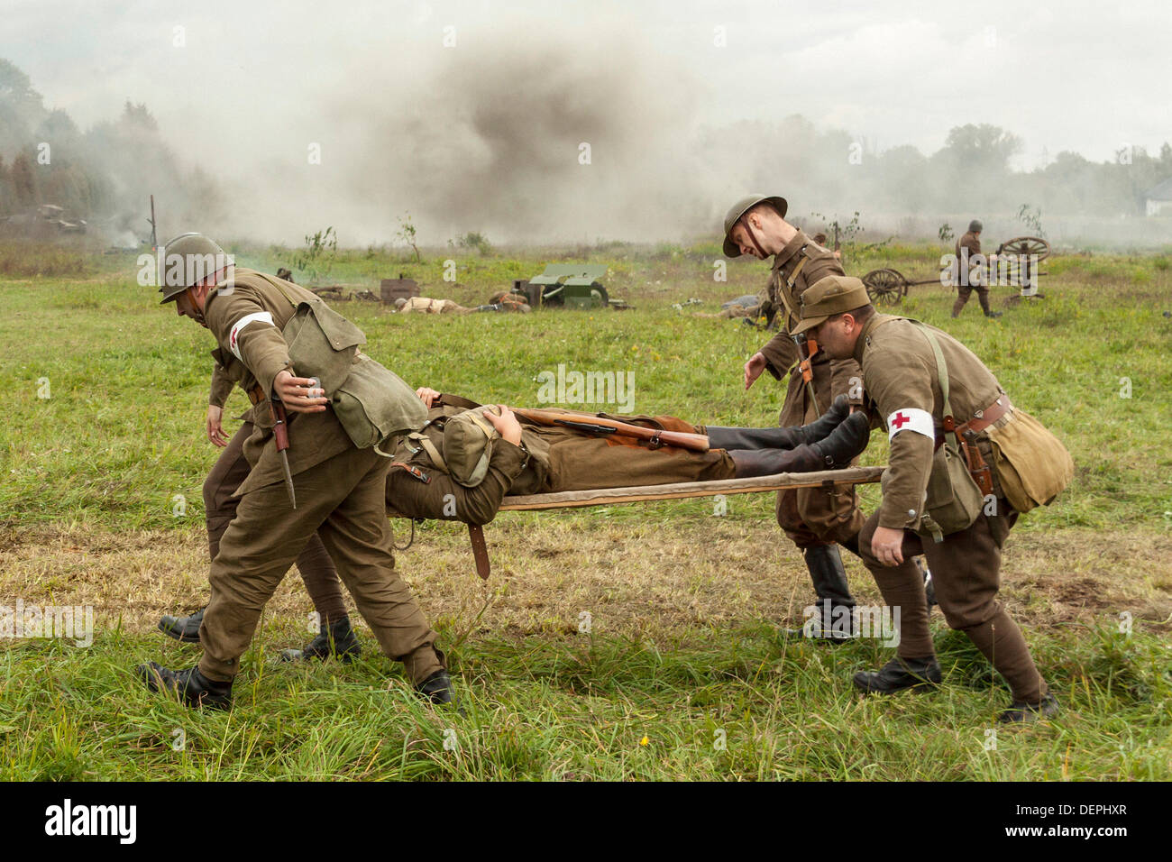 Lomianki, Poland. 22nd Sep, 2013. 22nd September, 2013. Paramedics carry wounded soldier during Battle at Lomianki - historical reenactment, Poland Credit:  Travelfile/Alamy Live News Stock Photo