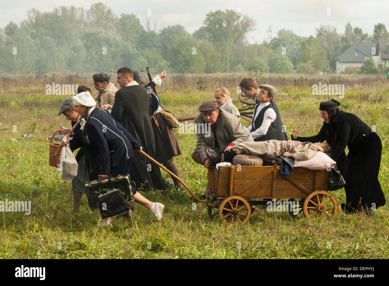 Lomianki, Poland. 22nd Sep, 2013. 22nd September, 2013. Polish civilians fleeing from aircraft bombing during Battle at Lomianki - historical reenactment, Poland Credit:  Travelfile/Alamy Live News Stock Photo