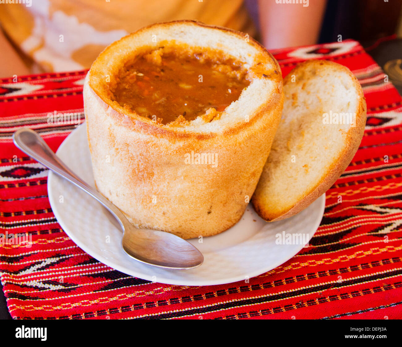 Romanian traditional soup in bread Stock Photo - Alamy