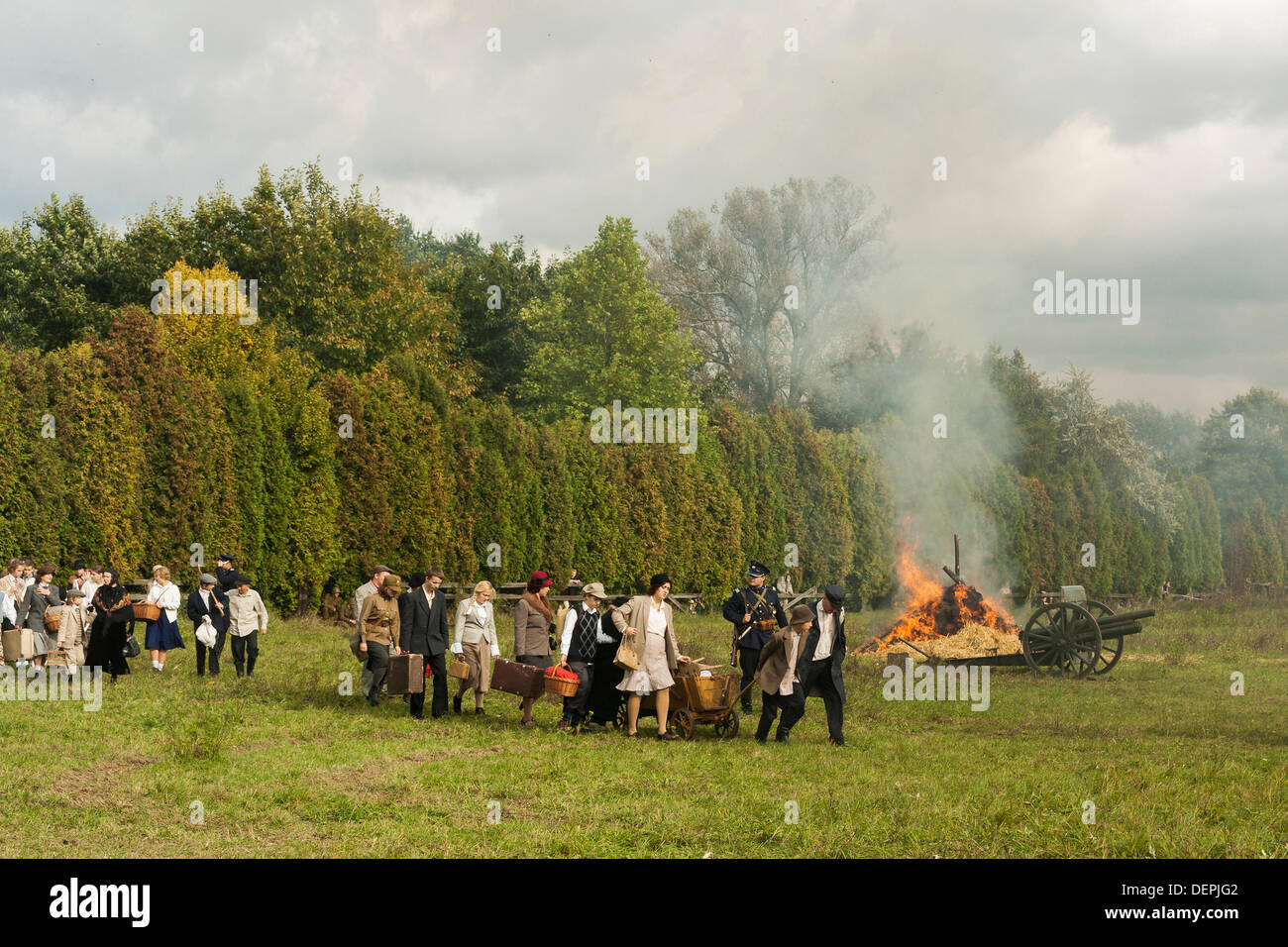 Lomianki, Poland. 22nd Sep, 2013. 22nd September, 2013. Polish civilians fleeing from aircraft bombing during Battle at Lomianki - historical reenactment, Poland Credit:  Travelfile/Alamy Live News Stock Photo