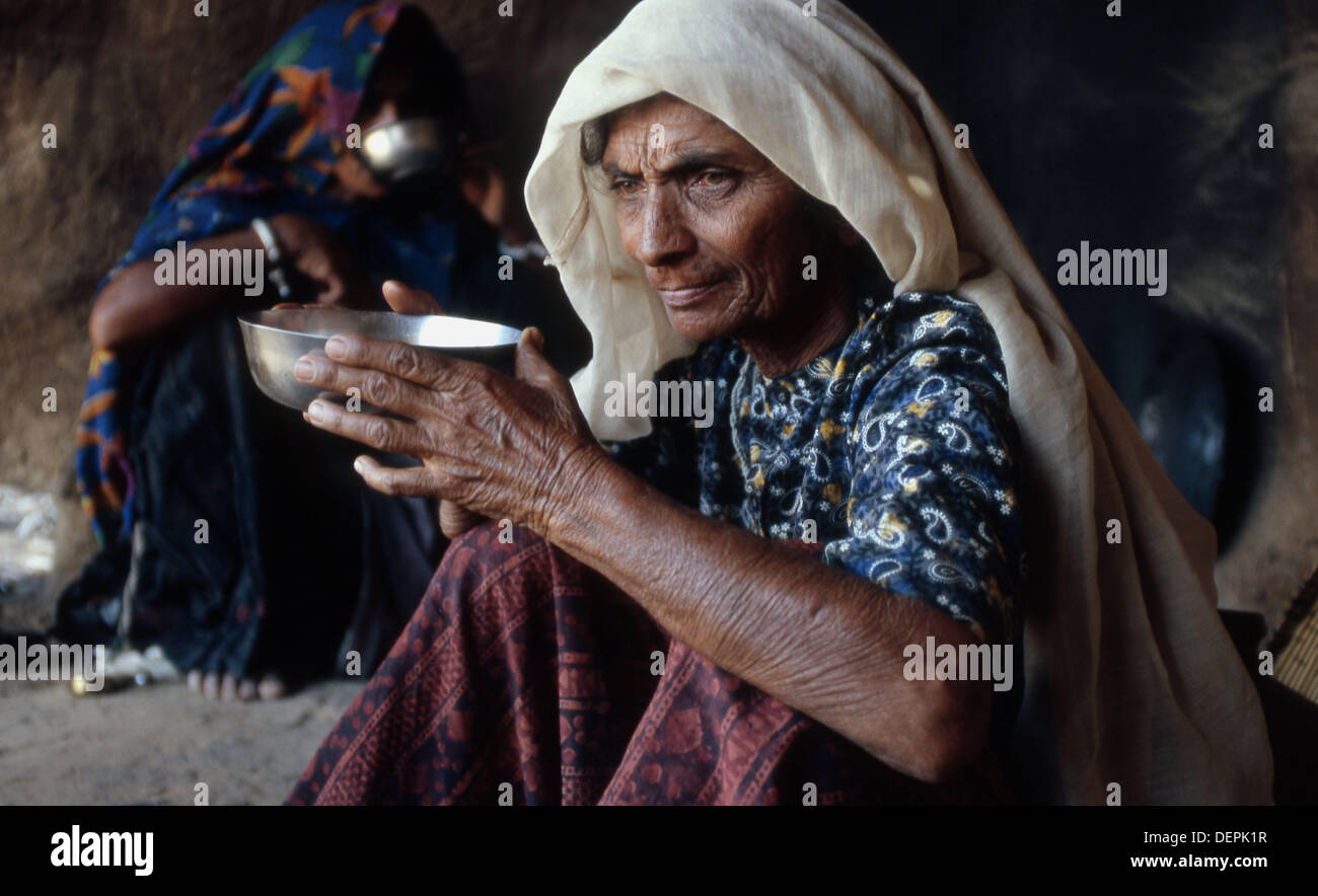 Two women drinking tea, Hanswua. Thar Desert, Rajasthan, India Stock