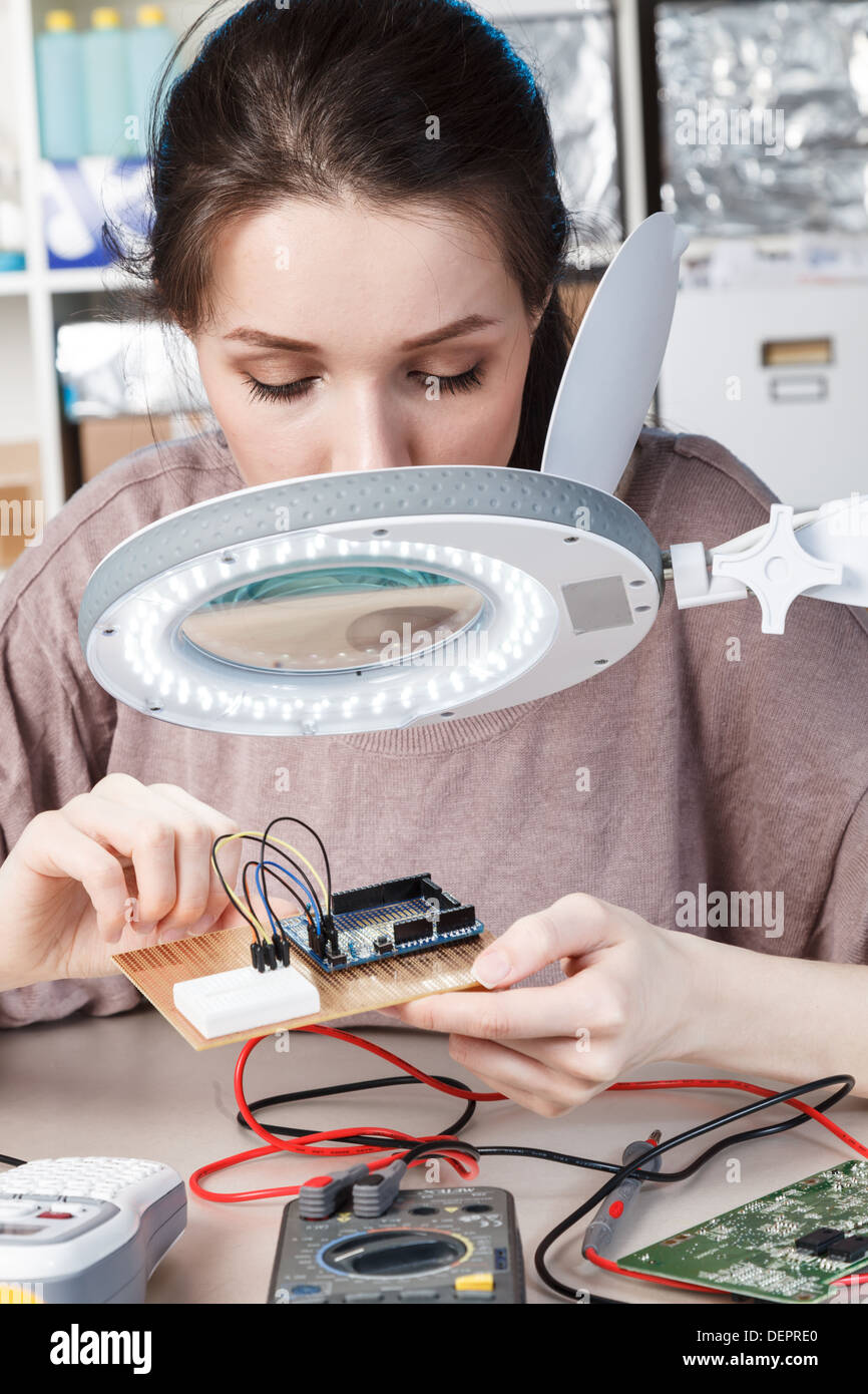 Girl in radio electronics lab Stock Photo Alamy