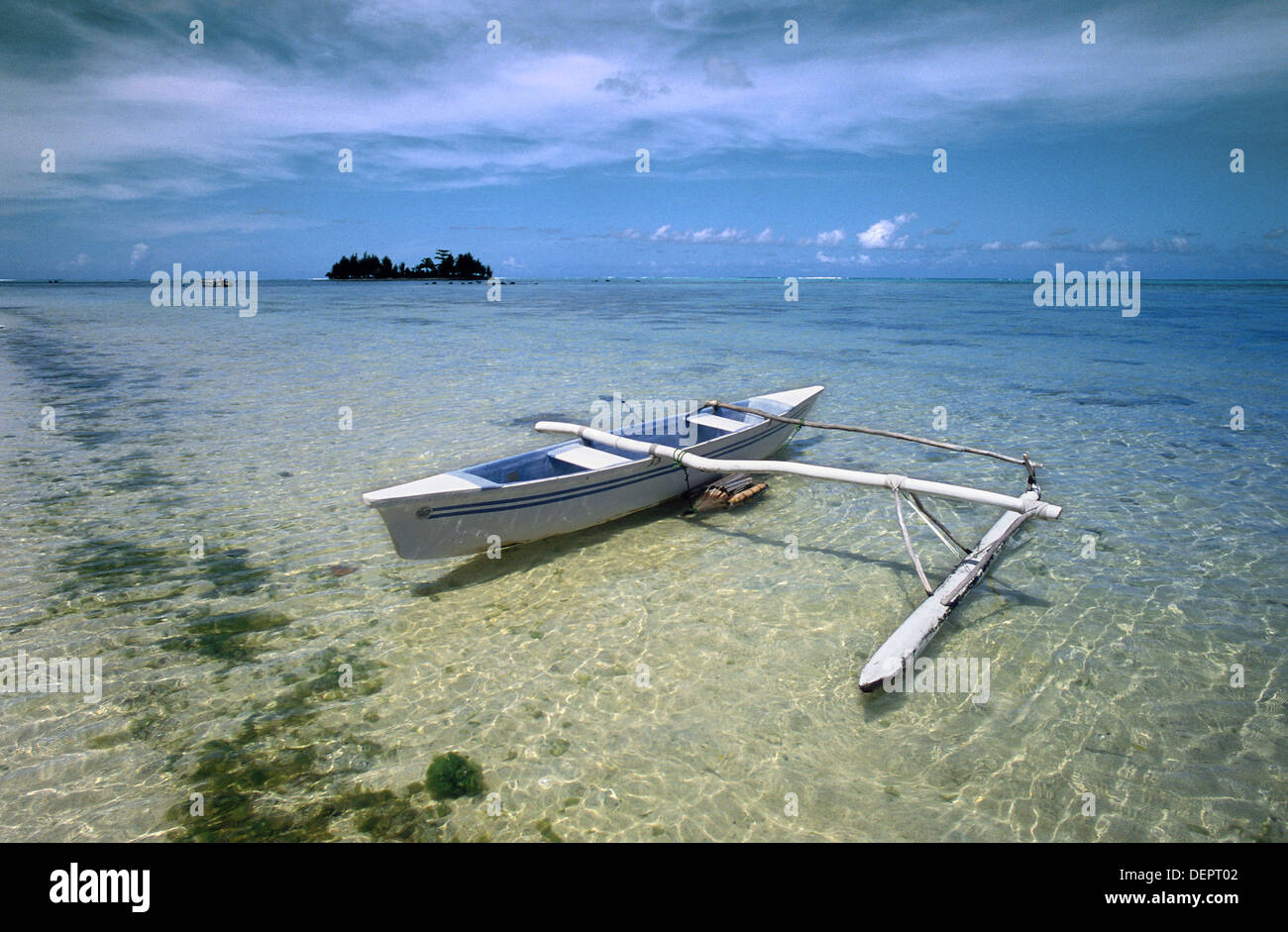 Tropical beach and double trigger canoe. Moorea. Tahiti. French