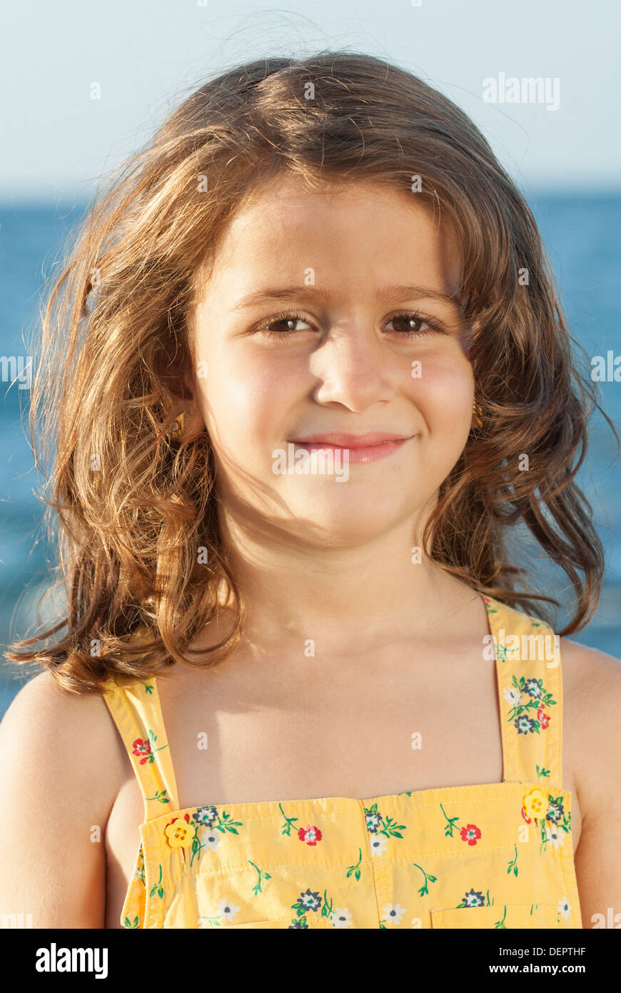 Little girl by the sea Stock Photo - Alamy
