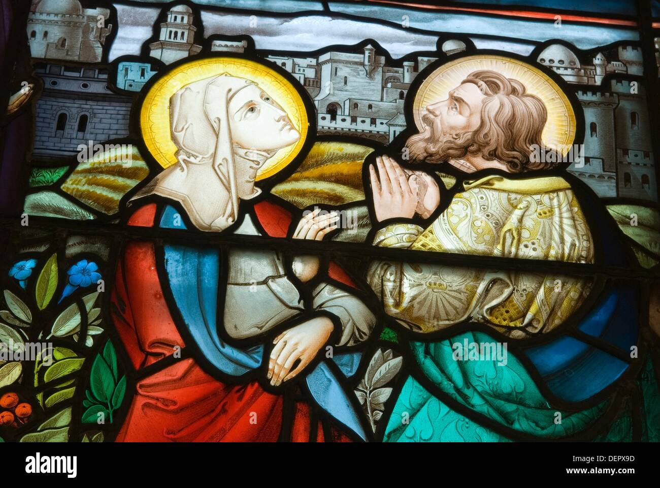 rare image of Marie-Madeleine looking up to God ,one hand on her womb,stained-glass window of St Peter ad Vincula Stock Photo